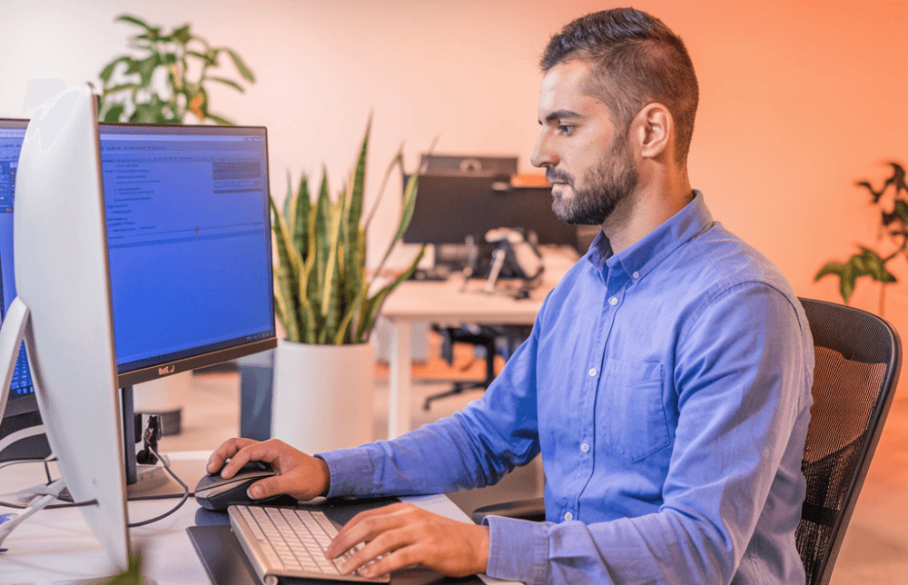 Man working behind a computer